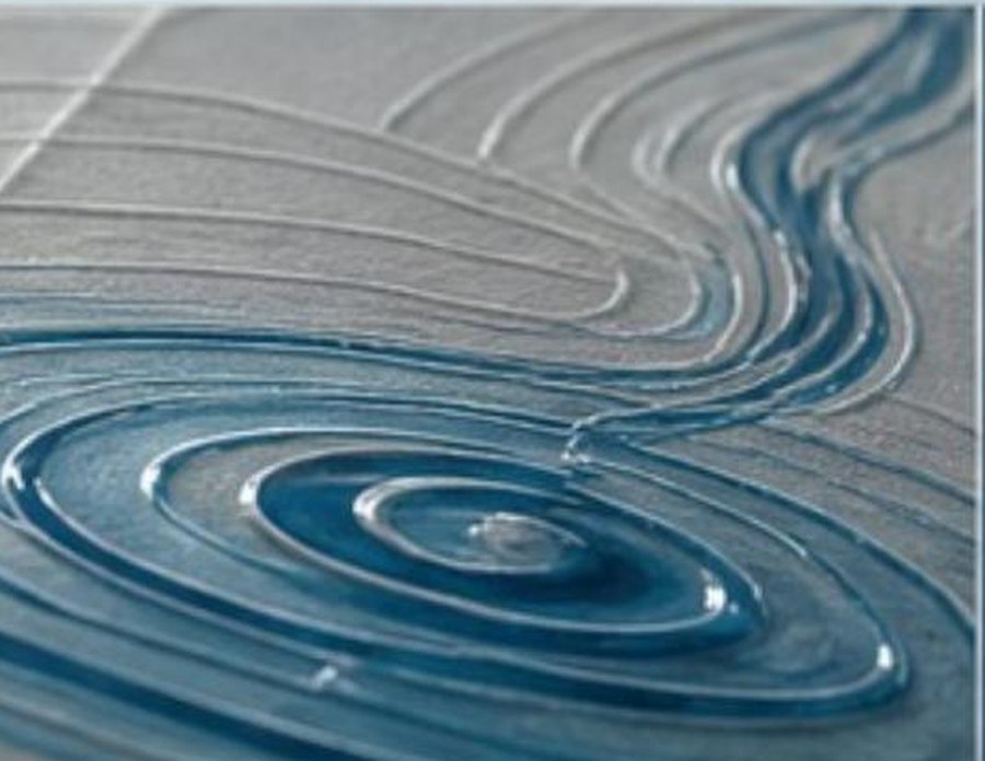 Macro of the spot-gloss ripple detail on the carton surface